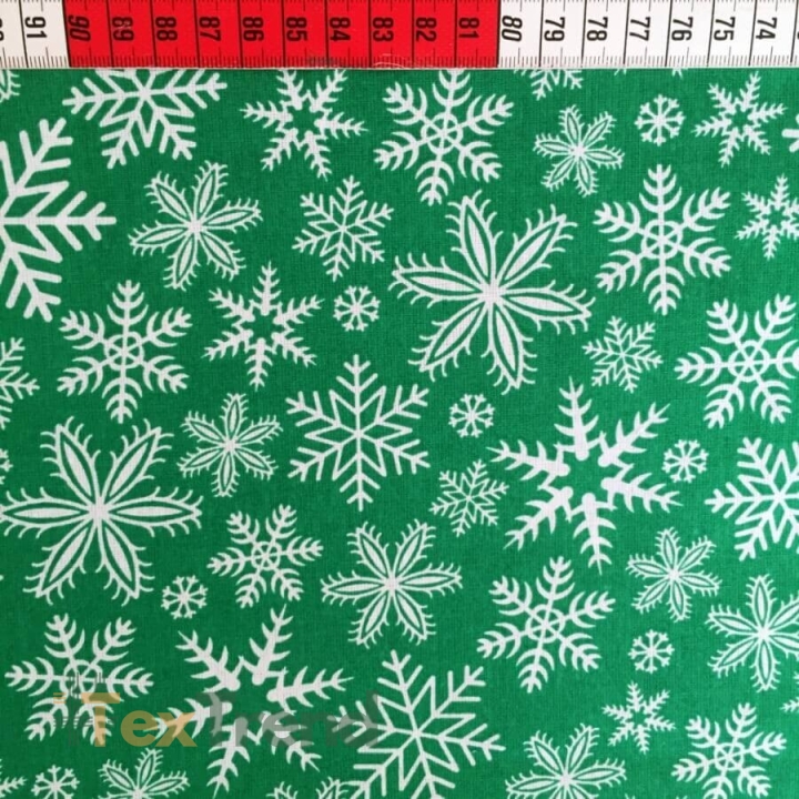 Baumwolle 100% Weihnachtsmuster weiße Schneeflocken auf grünem Hintergrund  