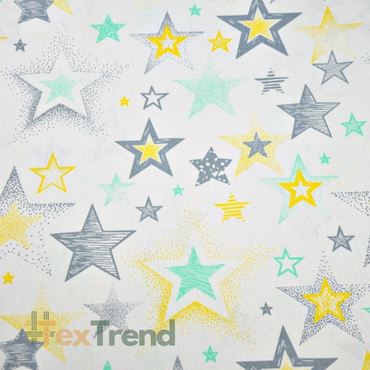 Baumwolle 100% gemusterte Sterne grau-gelb auf weißem Hintergrund  