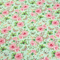 Baumwolle 100% Blumen mit Schmetterlingen rosa-grün auf grünem Hintergrund  