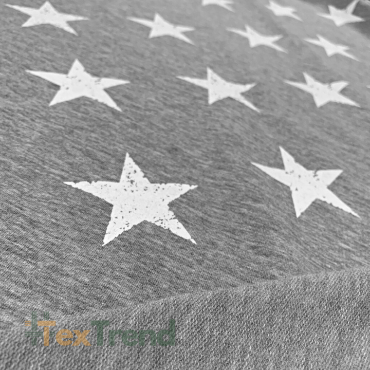 Jersey-Stoff - weiße Sterne auf grauem Melange-Hintergrund  