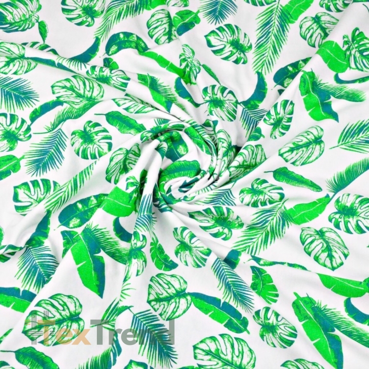 Jersey-Stoff mit grünen Blättern auf weißem Hintergrund  