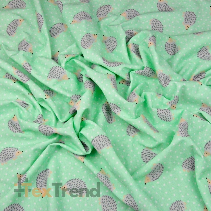 Jersey-Stoff mit Igeln auf mintfarbenem Hintergrund  