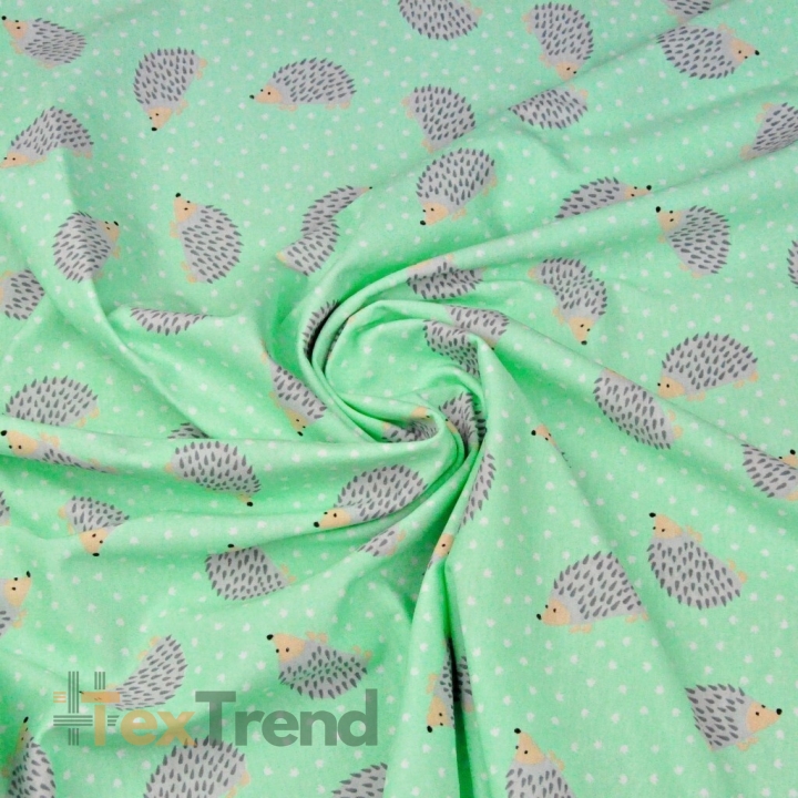 Jersey-Stoff mit Igeln auf mintfarbenem Hintergrund  