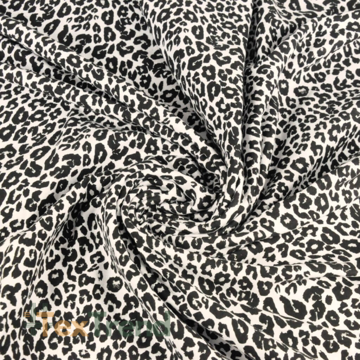 Einfarbiger Sweatstoff - glitzerndes Leopardenmuster schwarz auf ecrufarbenem Hintergrund  