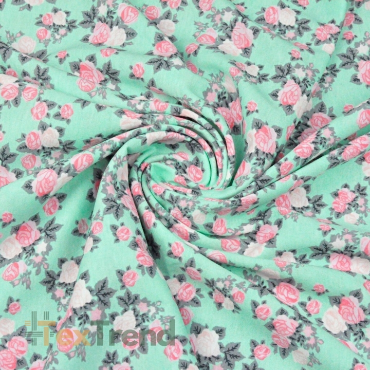 Jersey-Stoff mit rosa Röschen auf mintfarbenem Hintergrund  