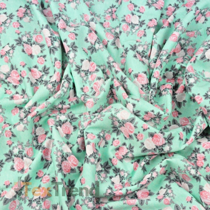 Jersey-Stoff mit rosa Röschen auf mintfarbenem Hintergrund  