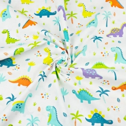 Baumwolle 100% Dinosaurier orange-lila mit Palmen auf weißem Hintergrund  
