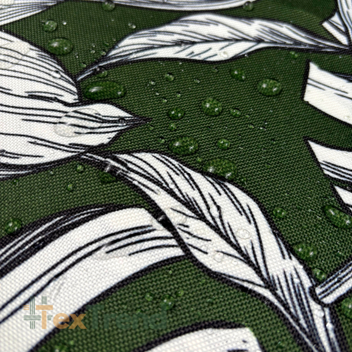 Wasserabweisender Codura-Stoff - Weiße Blätter auf grünem Hintergrund
