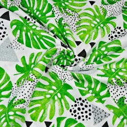 Baumwolle 100% grüne Monstera-Blätter mit grauen Dreiecken auf weißem Hintergrund  