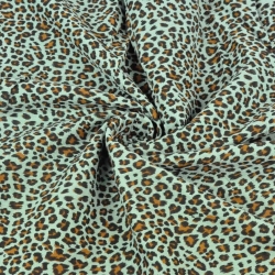 Baumwoll-Musselin plissiert Panther auf mintgrünem Hintergrund  