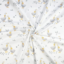 100% Baumwolle mit Gänsen und gelber Schleife auf weißem Hintergrund  