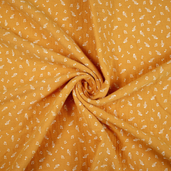 Muślin double gauze drukowany nutki na musztardowym tle