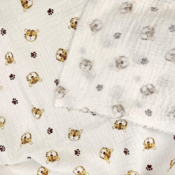 Musselin Double Gauze bedruckt mit beigen Tigerköpfen  