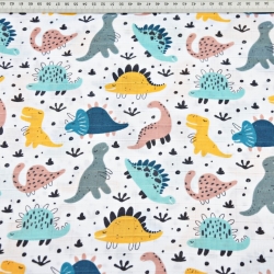 Baumwoll-Musselin mit bunten Dinosauriern auf weißem Hintergrund  