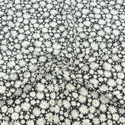 Jersey-Strick Gänseblümchen auf schwarzem Hintergrund  