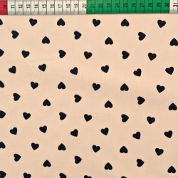 Baumwolle 100% 8 mm Schwarze Herzen auf apricotfarbenem Hintergrund  