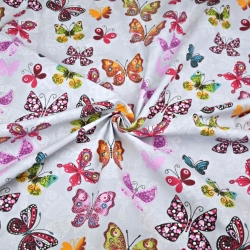 Baumwolle 100% gemusterte Schmetterlinge auf grauem Hintergrund