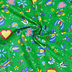 Baumwolle 100% Kaschubisches Muster blau auf grünem Hintergrund  