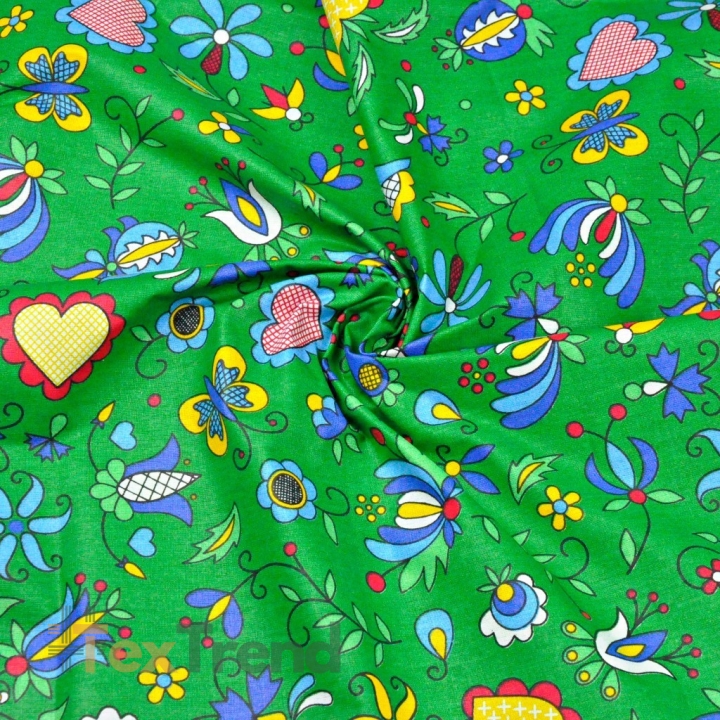 Baumwolle 100% Kaschubisches Muster blau auf grünem Hintergrund  