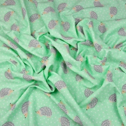 Jersey-Stoff mit Igeln auf mintfarbenem Hintergrund  