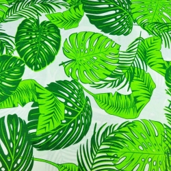 100% Baumwolle - große grüne Monstera-Blätter auf weißem Hintergrund  