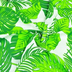 100% Baumwolle - große grüne Monstera-Blätter auf weißem Hintergrund  