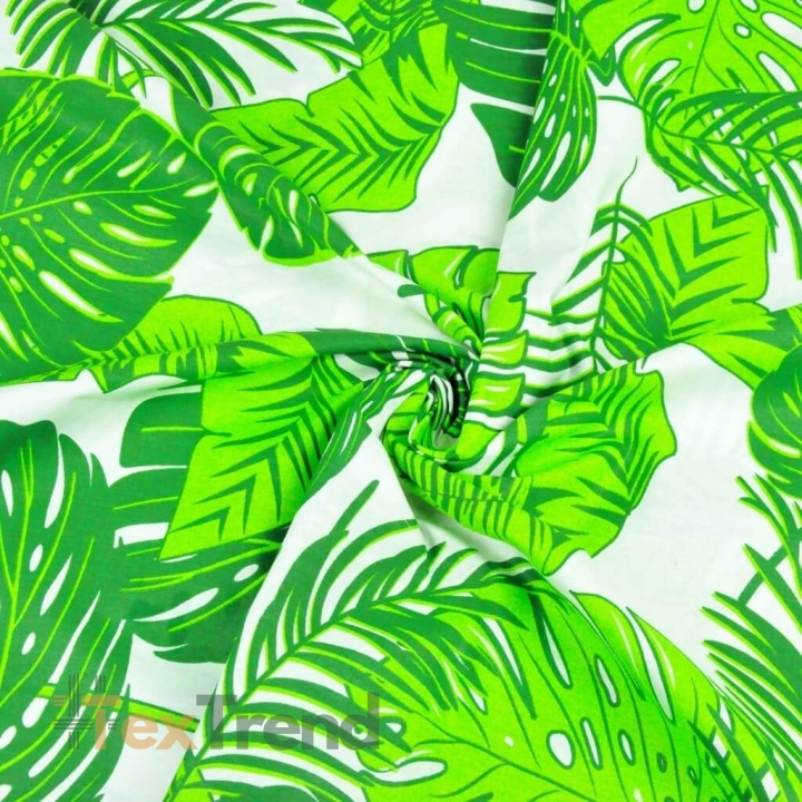 100% Baumwolle - große grüne Monstera-Blätter auf weißem Hintergrund  