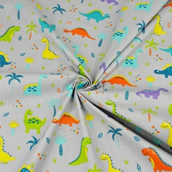 Baumwolle 100% Dinosaurier orange-lila mit Palmen auf grauem Hintergrund  