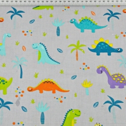 Baumwolle 100% Dinosaurier orange-lila mit Palmen auf grauem Hintergrund  
