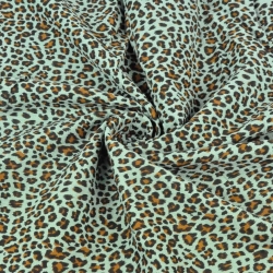 Baumwoll-Musselin plissiert Panther auf mintgrünem Hintergrund  