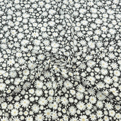 Jersey-Strick Gänseblümchen auf schwarzem Hintergrund  