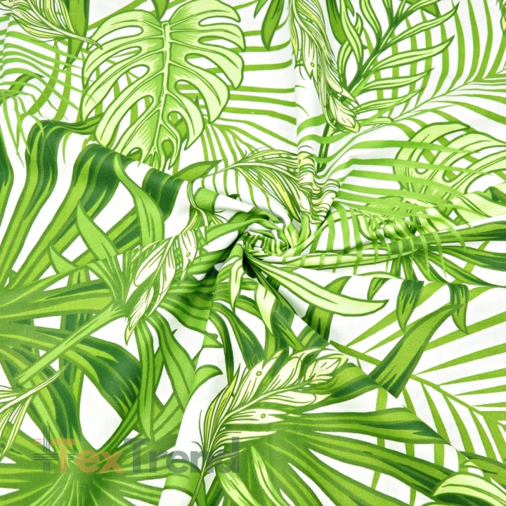 Baumwolle 100% grüne Palm- und Monstera-Blätter auf weißem Hintergrund  