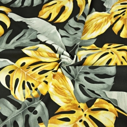 Baumwolle 100% Monstera- und Bananenblätter gold-grau auf schwarzem Hintergrund  