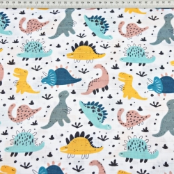 Baumwoll-Musselin mit bunten Dinosauriern auf weißem Hintergrund  