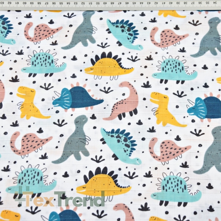 Baumwoll-Musselin mit bunten Dinosauriern auf weißem Hintergrund