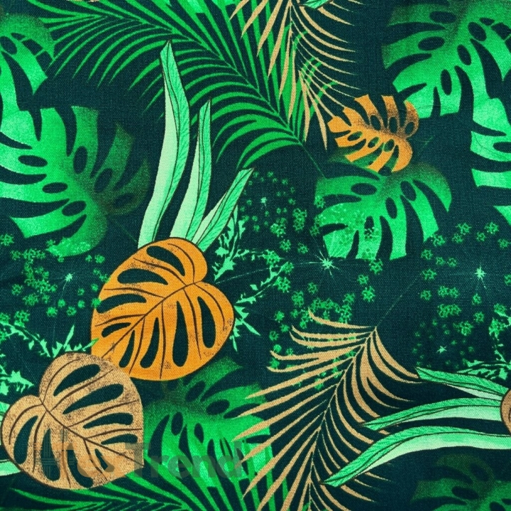 Liegestoff mit Monstera-Blättern in Orange auf schwarzem Hintergrund  