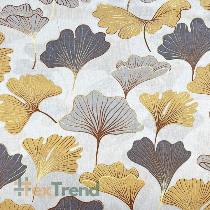 100% Baumwolle mit Ginkgo in grau-gold auf grauem Hintergrund  