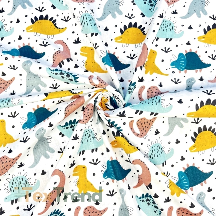 100% Baumwolle mit bunten Dinosauriern auf weißem Hintergrund  