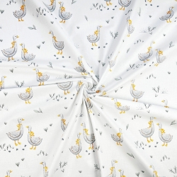 100% Baumwolle mit Gänsen und gelber Schleife auf weißem Hintergrund  