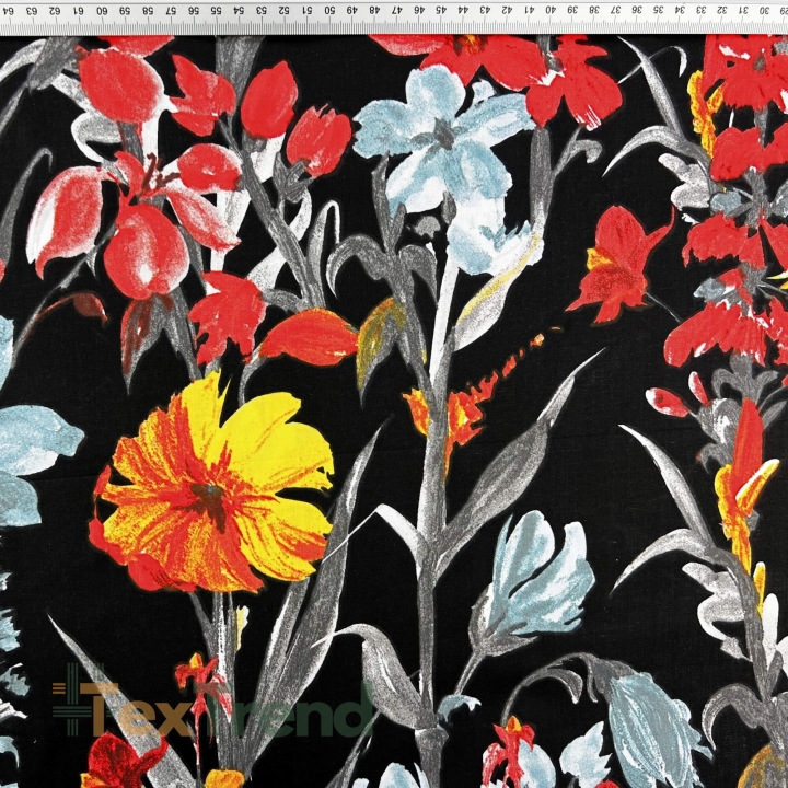 100% Baumwolle mit gelb-roten Blumen auf schwarzem Hintergrund  