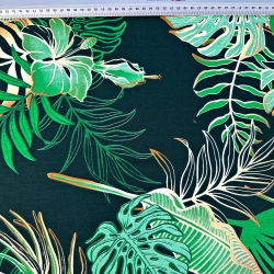 Baumwolle 100% Monstera- und Bananenblätter mit Blumen auf grünem Hintergrund  