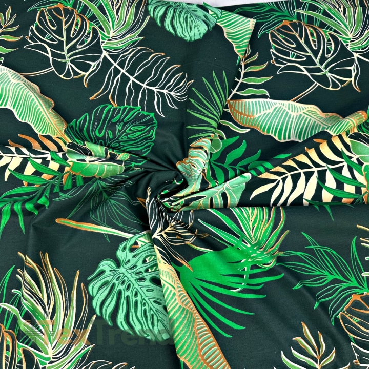 Baumwolle 100% Monstera- und Bananenblätter mit Blumen auf grünem Hintergrund  