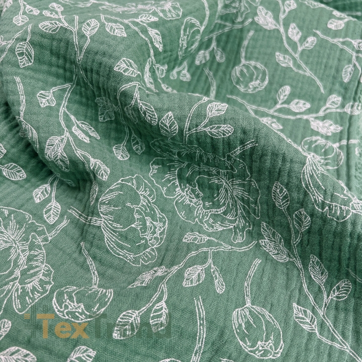 Muslin Double Gauze bedruckte Blumenumrisse auf salbeigrünem Hintergrund  