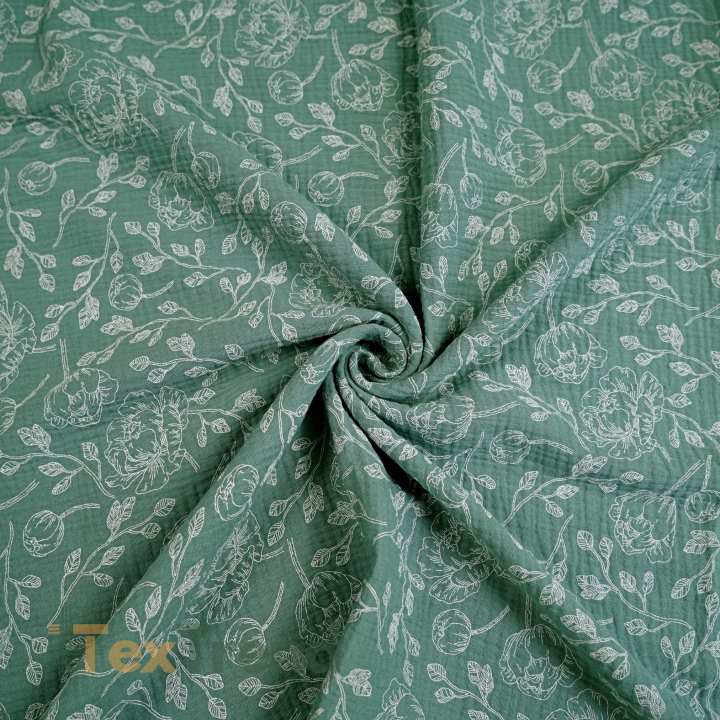 Muslin Double Gauze bedruckte Blumenumrisse auf salbeigrünem Hintergrund  