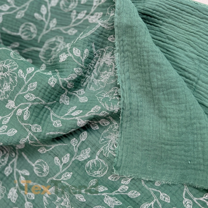 Muslin Double Gauze bedruckte Blumenumrisse auf salbeigrünem Hintergrund  