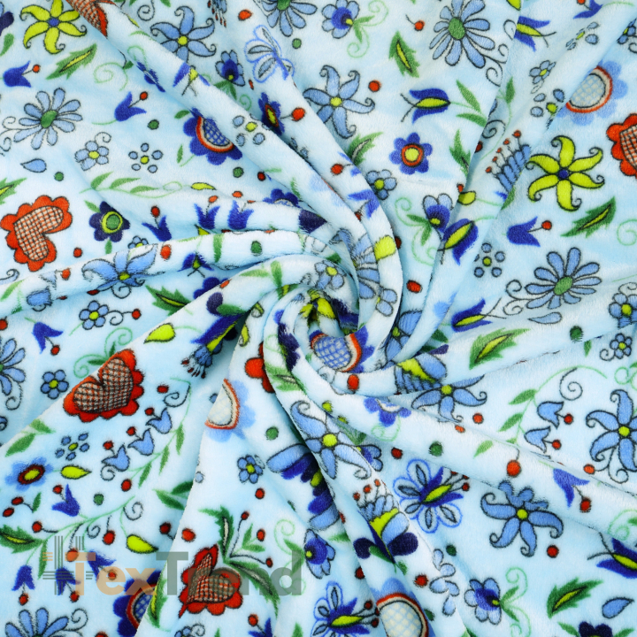 Kuschelfleece Stoff – Kinder Muster - kaschubisches Muster bunt auf blauem Hintergrund