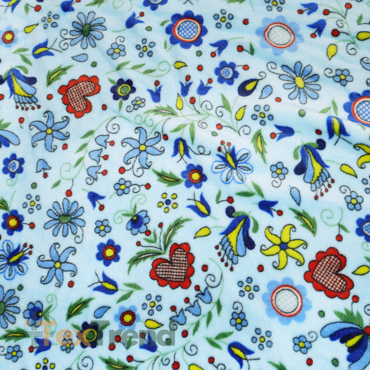 Kuschelfleece Stoff – Kinder Muster - kaschubisches Muster bunt auf blauem Hintergrund