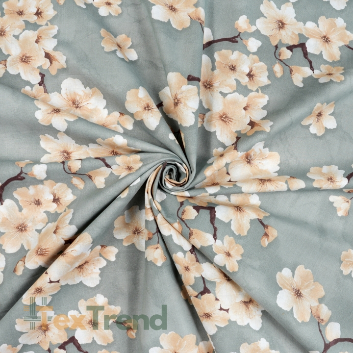 100% Baumwolle Kirschblüte Beige auf salbeifarbenem Hintergrund